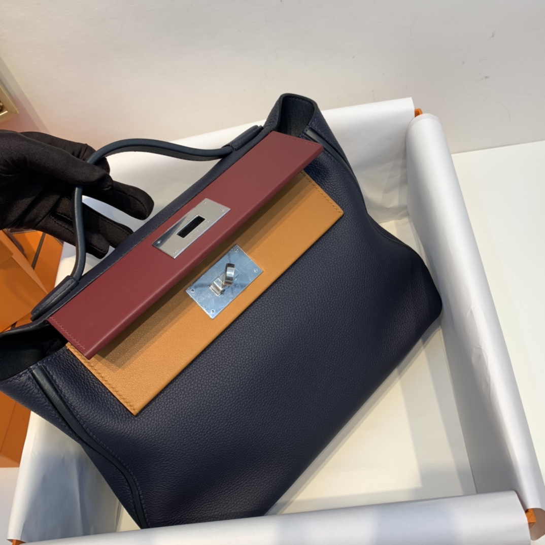 HERMES 爱马仕官网直销 订单 走秀款24/24 birkin和kelly完美结合、少了老kelly的硬朗 多了一份随性的休闲气息 togo皮质   午夜蓝拼宝石红拼太妃糖 银扣